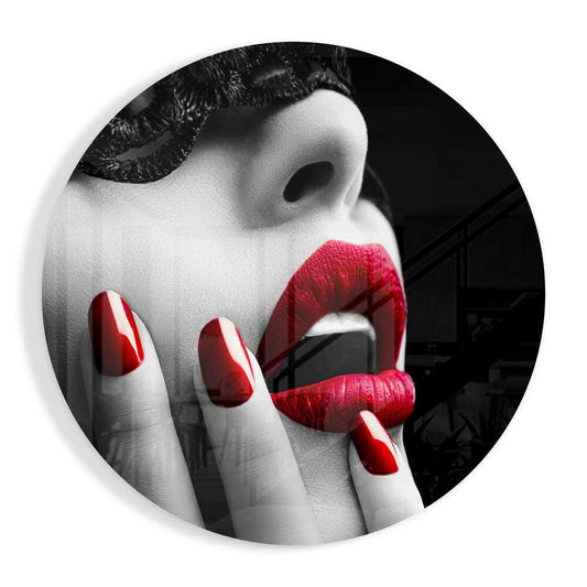 Close-up of mannequin face with red lips and red-and-white striped nails in black and white selective color photograph.