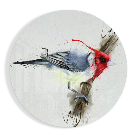 Red-crested bird perched on branch with blue-gray plumage and red head rendered in watercolor splatter style on circular white glass panel.