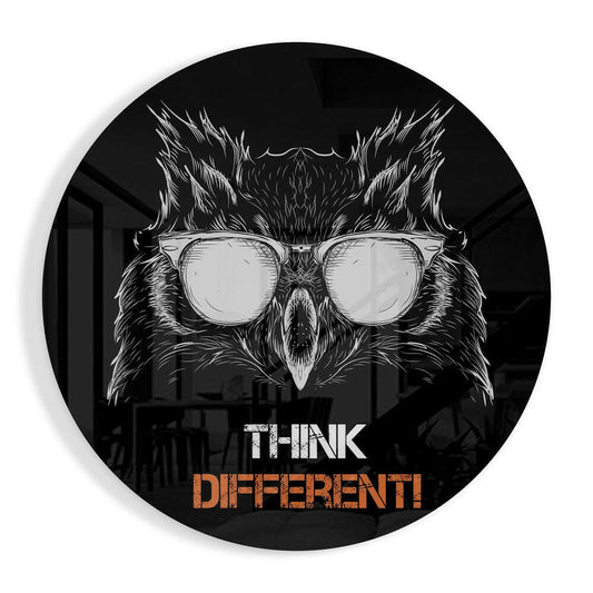 Circular black glass wall art featuring white line-drawn owl wearing oversized glasses with "THINK DIFFERENT!" text in white and orange.