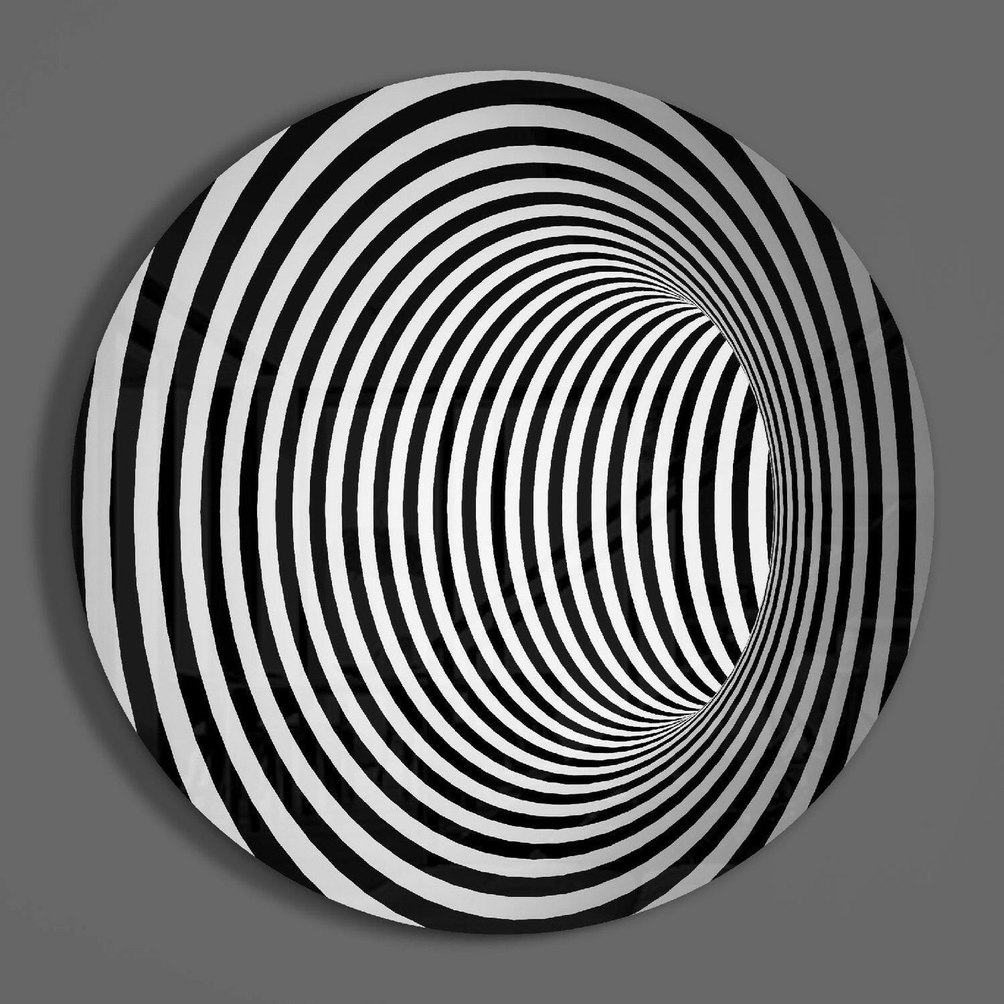 Circular glass wall art with alternating black and white concentric rings creating an optical illusion tunnel effect on gray background.