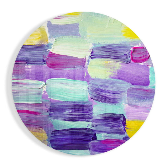 Circular glass wall art featuring horizontal brushstrokes in purple, teal, pink, yellow, and white on a white background.