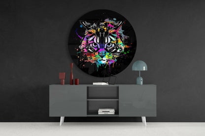 Colorful neon tiger face artwork displayed as round wall art above gray mid-century modern sideboard in dark interior setting.