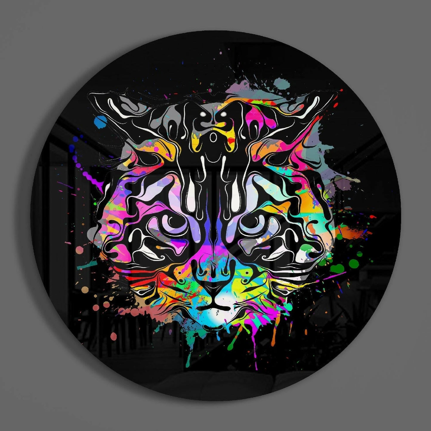 Vibrant multicolored cat face with neon pink, blue, and yellow paint splatters on black circular vinyl record.