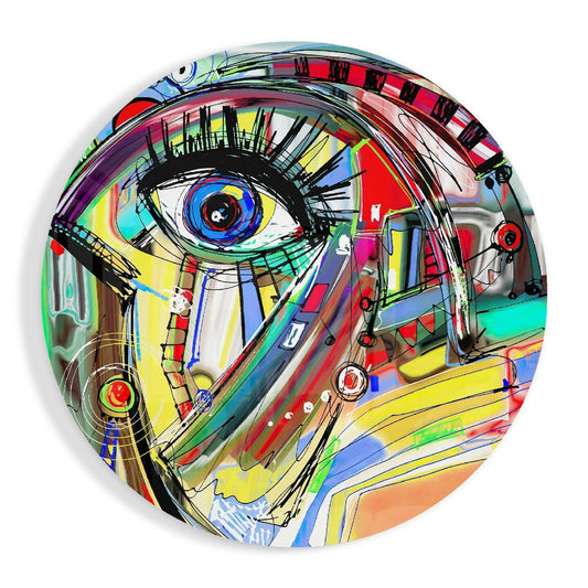 Circular glass wall art featuring a colorful abstract face with a prominent eye, multi-colored geometric patterns, and black line drawings throughout.