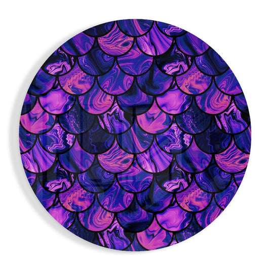 Circular glass wall art displaying overlapping iridescent mermaid scales in vibrant purple, pink, and blue swirling patterns with black outlines.