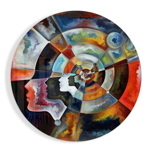 Circular glass wall art featuring two profile silhouettes facing each other with concentric rings of marbled watercolor patterns in blues, oranges, reds, and yellows.