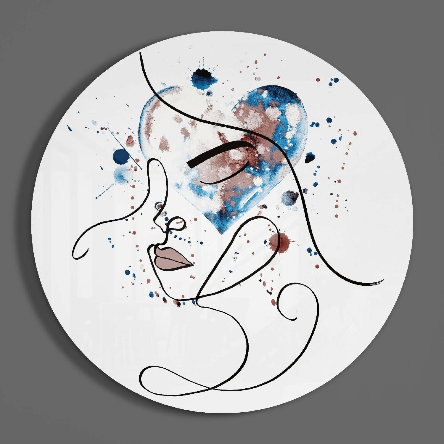 Circular glass wall art featuring minimalist line-drawn profile with blue and brown watercolor splashes on white background.