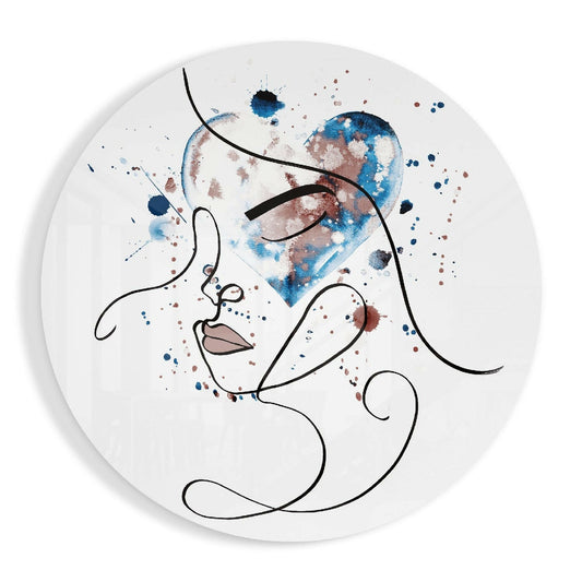Circular glass wall art featuring minimalist line-drawn face with blue and brown watercolor splashes on white background.