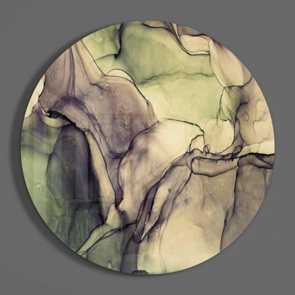 Circular green marble glass wall art with cream, beige, and purple veining viewed from above against gray background.