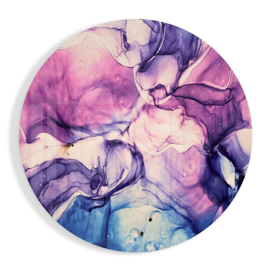 Circular glass wall art with swirled pink, purple, and blue marbled patterns, overhead view showing fluid color gradients and translucent effects.