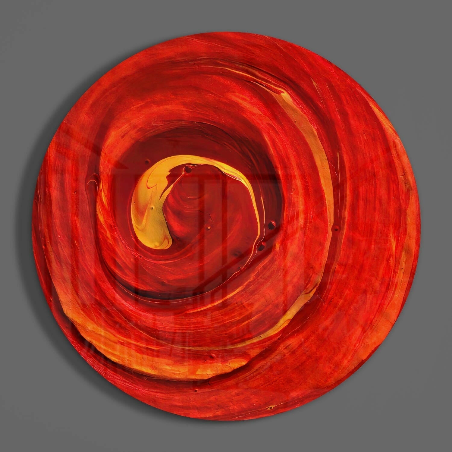 Red Cycle Glass Wall Art displayed front-on, showing concentric spiraling circles in red, orange, and yellow glass against gray background.