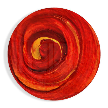 Red and orange concentric glass circles forming a spiral pattern, viewed from directly above, with yellow highlights in the center.