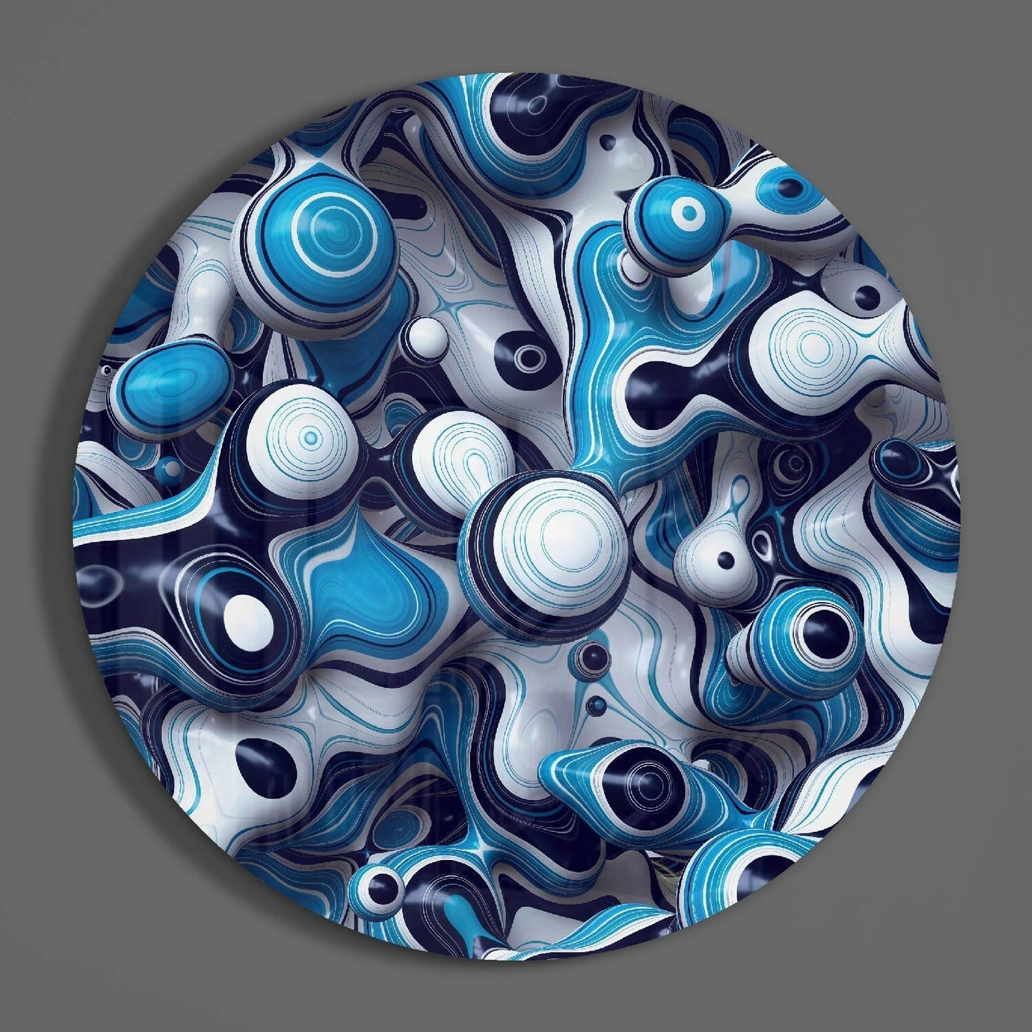 Overhead view of circular blue glass wall art featuring layered concentric circles and swirling navy, cyan, and white patterns on gray background.