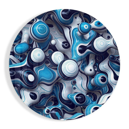 Overhead view of circular glass wall art featuring layered blue, white, and navy abstract swirls with concentric circles and organic shapes.