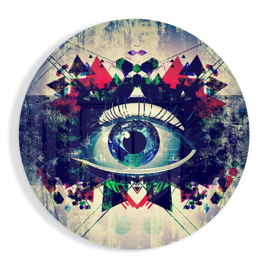Round glass wall art featuring a stylized eye with turquoise iris, surrounded by geometric shapes, forest imagery, and layered red, green, and cream tones on distressed background.