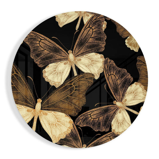 Round glass wall art with gold and bronze butterflies in detailed stippled pattern on black background, front view.