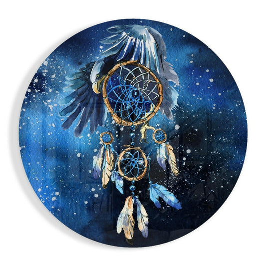 Blue circular glass wall art featuring an eagle with spread wings above a tan and blue dreamcatcher with feather details against a starry night sky background.