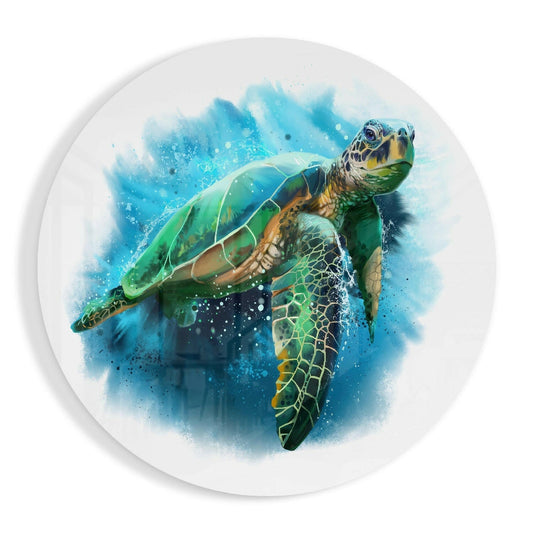 Round white glass wall art featuring a watercolor sea turtle in blue, green, and yellow tones swimming against a blue ink splash background.