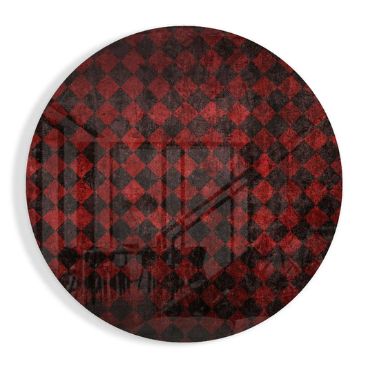Circular red and black distressed checkerboard pattern glass wall art displayed flat against white background.