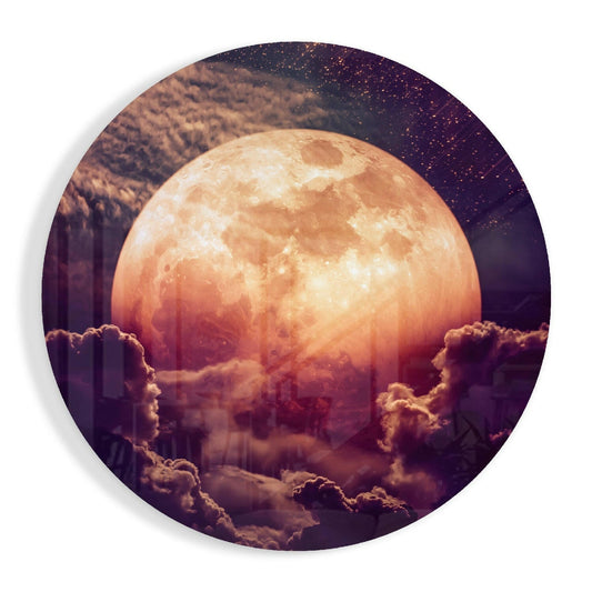 Large glowing orange moon surrounded by purple and golden clouds against a starry night sky on circular glass art.