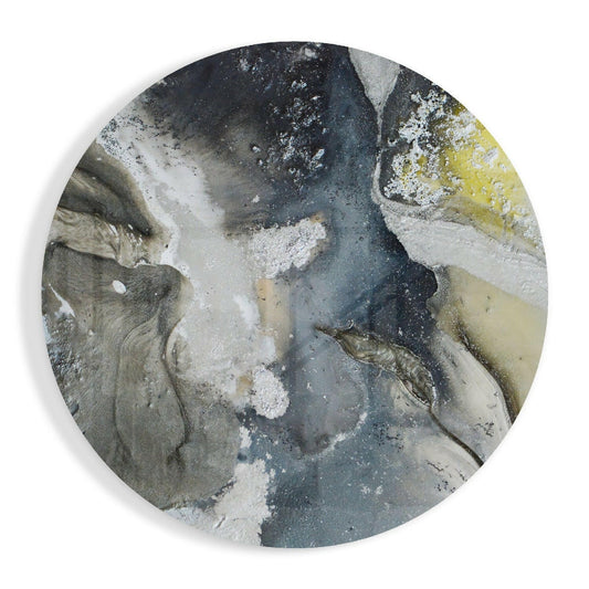 Overhead view of circular slate gray and yellow marble glass wall art showing layered gray tones with white crystalline deposits and moss-green accents.