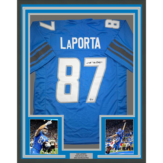 Framed Detroit Lions blue jersey number 87 with LaPorta nameplate, signed, displayed with two action photos and authentication plaque.
