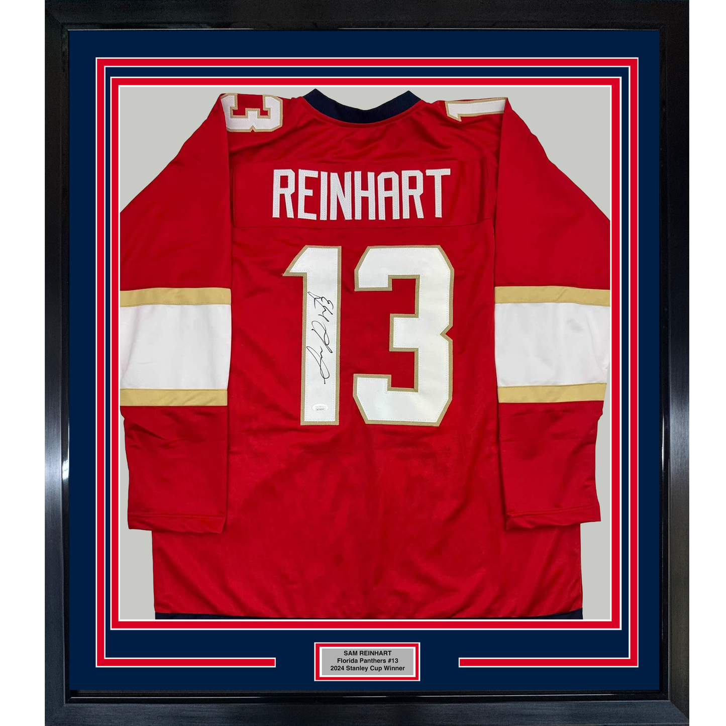 Red Florida Panthers hockey jersey number 13 with "REINHART" nameplate and autograph, framed with blue and red matting.