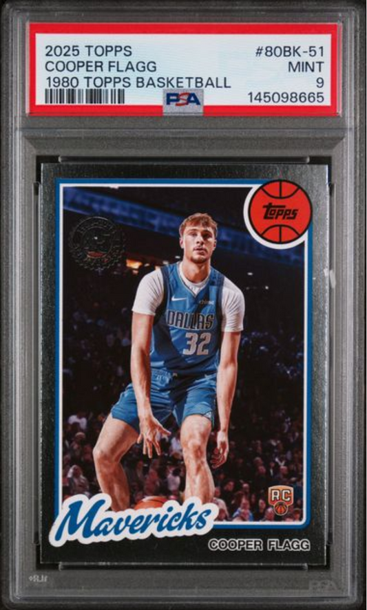 PSA graded card in clear holder showing Cooper Flagg in Dallas Mavericks blue jersey number 32, with red Topps logo and 1980s-style design border.