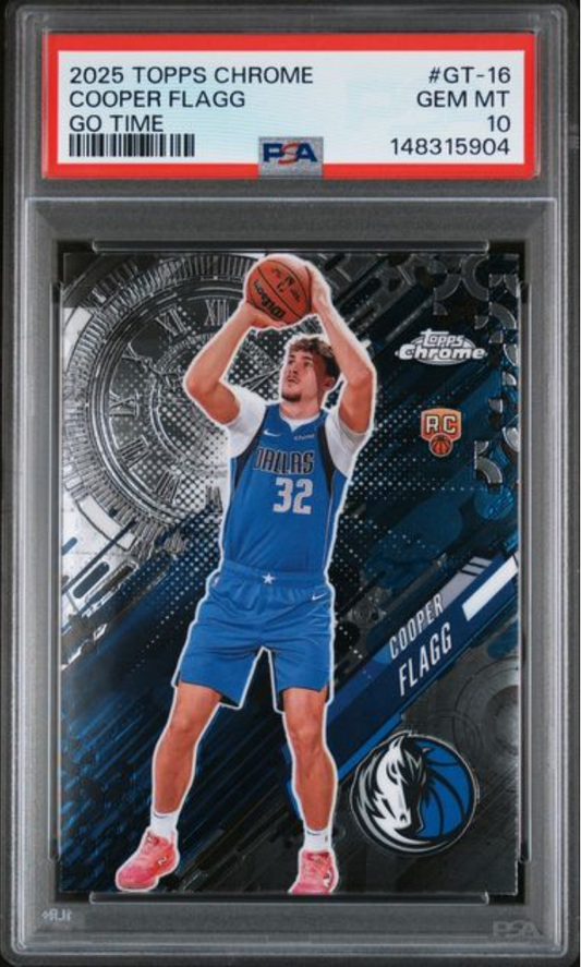 PSA graded card in clear plastic holder showing Cooper Flagg in Dallas Mavericks blue uniform shooting basketball, with red label and grade 10 visible.