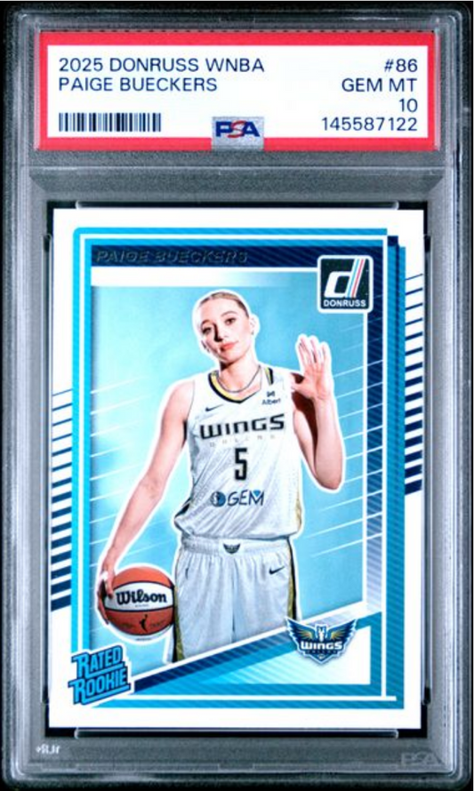 PSA-graded sports card in clear plastic case showing Paige Bueckers in white Dallas Wings uniform holding basketball against blue background.