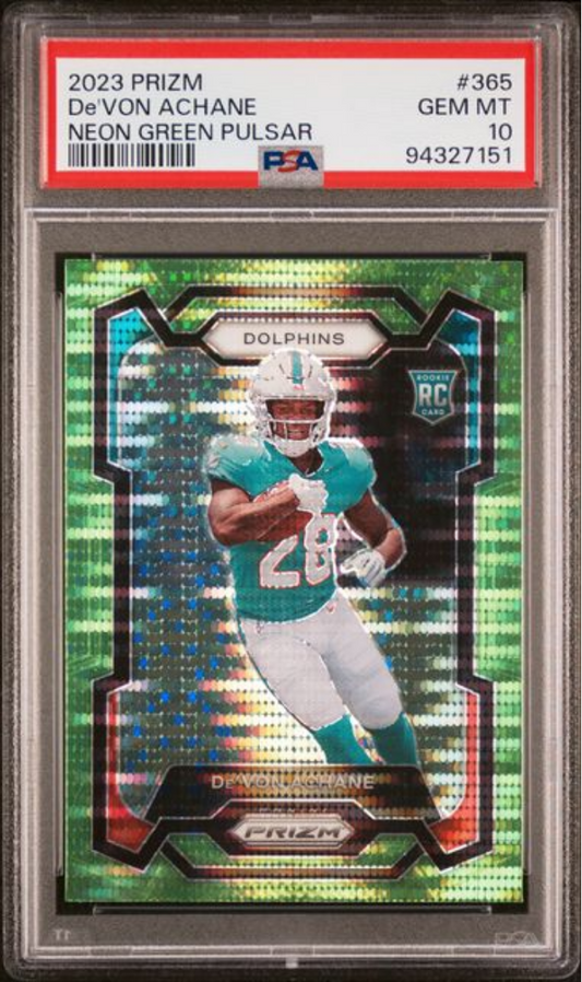 PSA-graded trading card in clear case displaying Devon Achane in teal Dolphins uniform on vibrant neon green pulsar background.