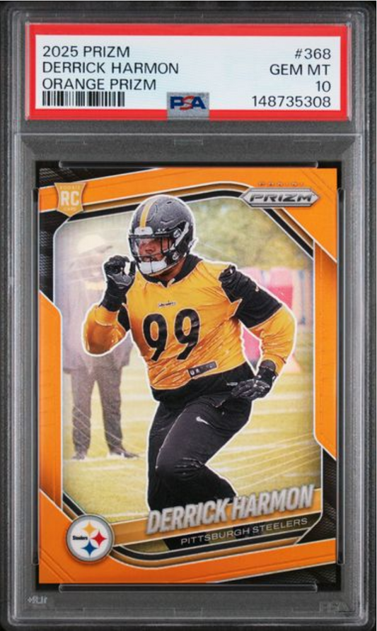 PSA-graded sports card in clear plastic case showing Derrick Harmon in yellow Steelers uniform on orange Prizm background with red label identifying card details.