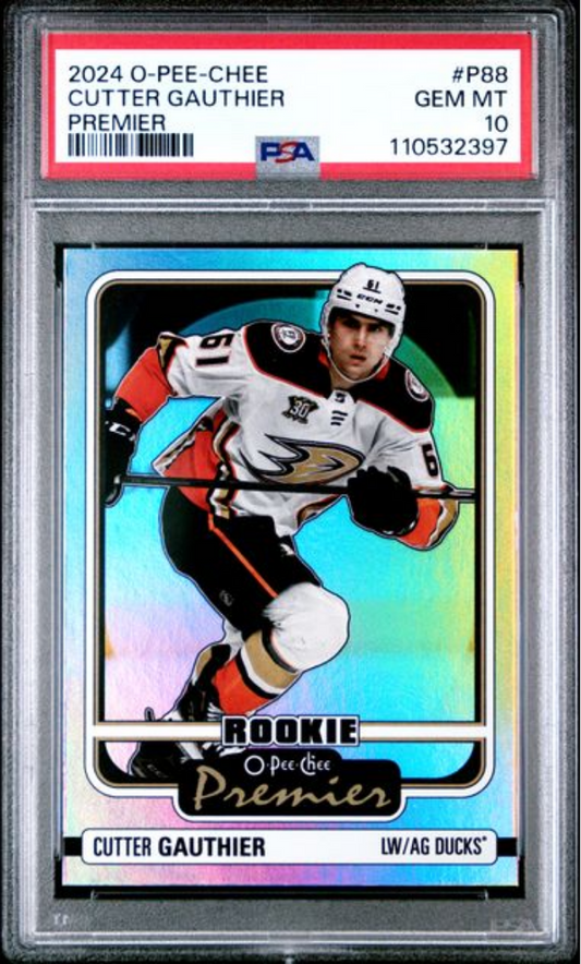PSA-graded rookie hockey card in protective case showing Cutter Gauthier in Ducks uniform against holographic rainbow background.