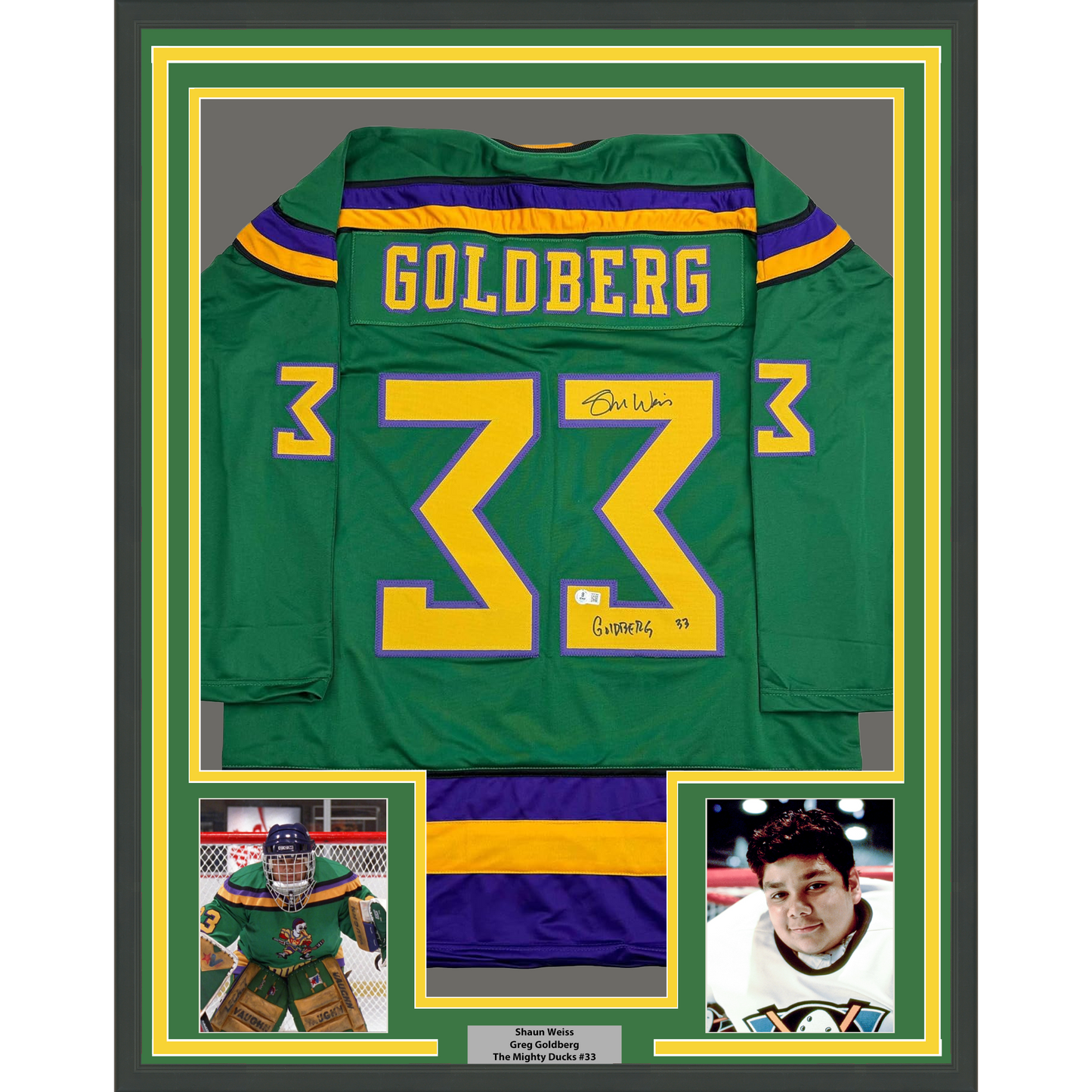 Framed green Mighty Ducks hockey jersey number 33 with "Goldberg" nameplate, signed, displayed with two player photos below.