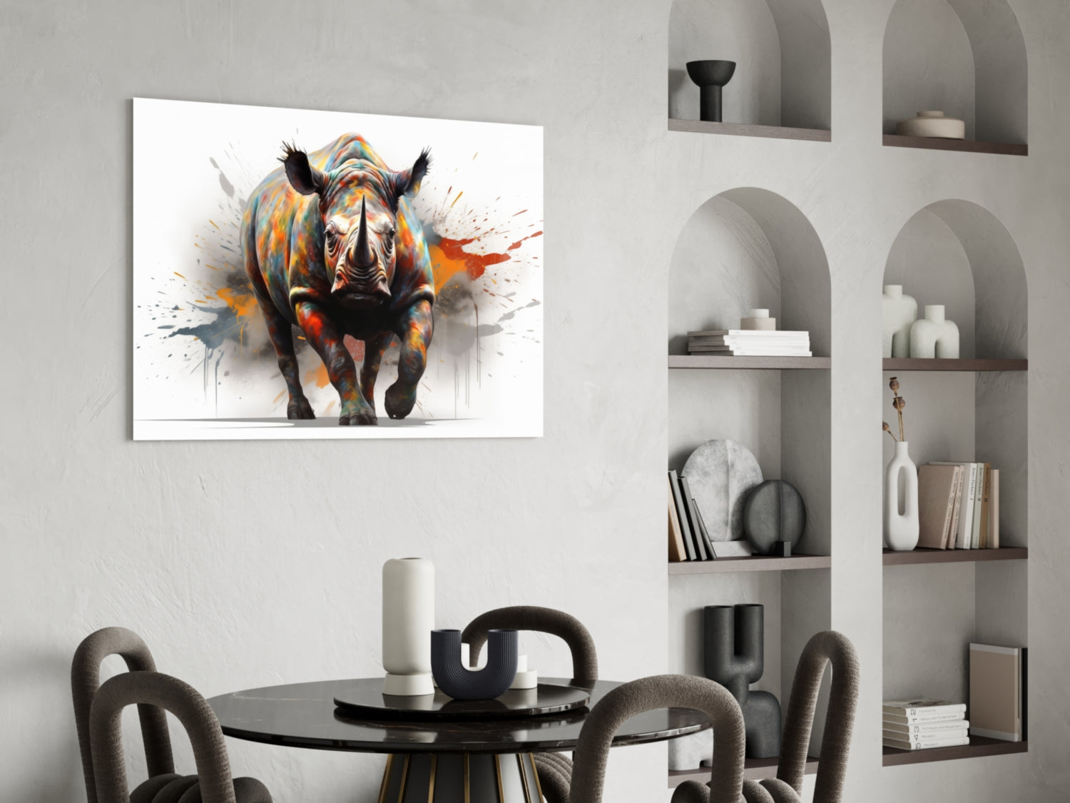 Colorful abstract rhino glass wall art displayed above a black round dining table in a modern interior with arched shelving.