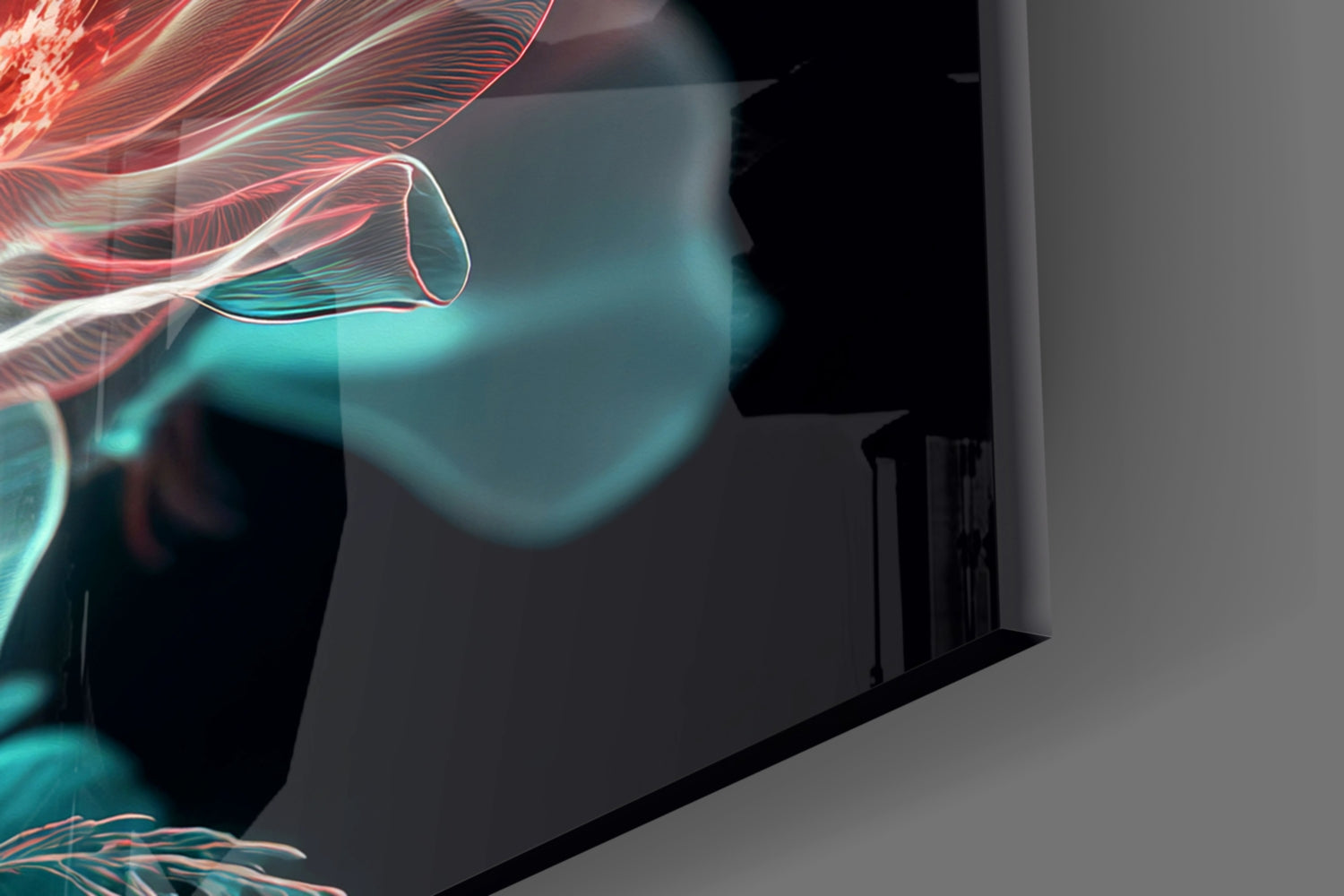 Close-up view of glass wall art displaying red and turquoise luminescent flower petals with glowing line details against dark background.