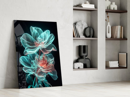 Neon turquoise and coral glowing flowers on black glass panel leaning against white wall beside wooden shelving.