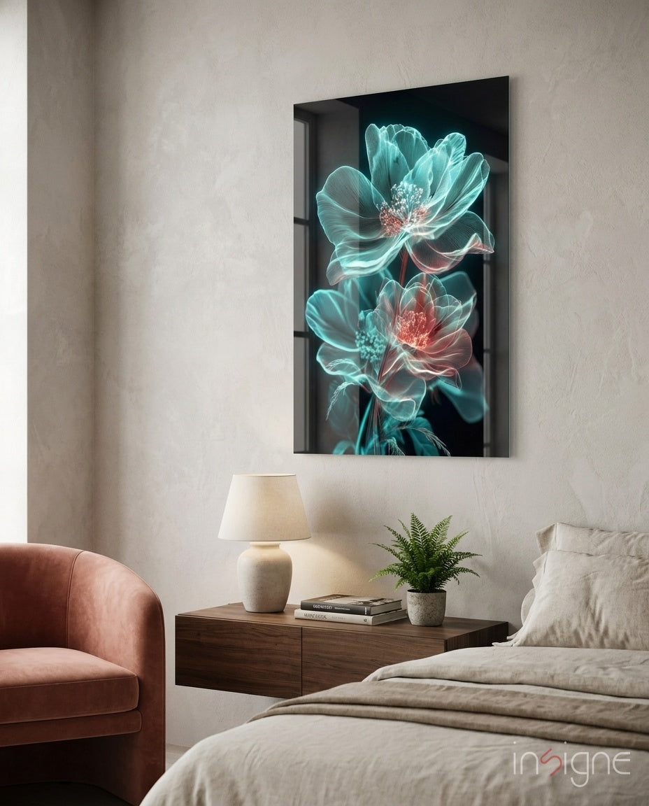 Glowing neon turquoise and coral flowers on black glass panel displayed above wooden bedside table in modern bedroom.