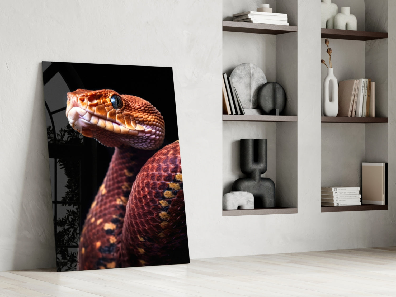Red and orange viper glass art leaning against wall beside white shelving unit with decorative objects.
