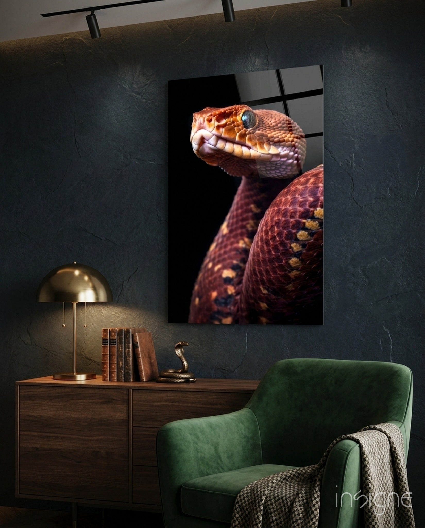 Red and orange viper glass wall art displayed above wooden desk in modern interior setting with green chair.