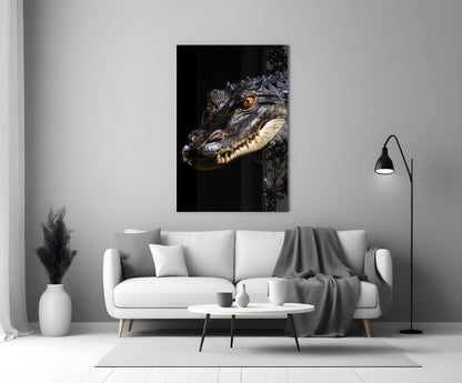 Crocodile head with golden eye and open mouth against black background, displayed above white sofa in modern living room.