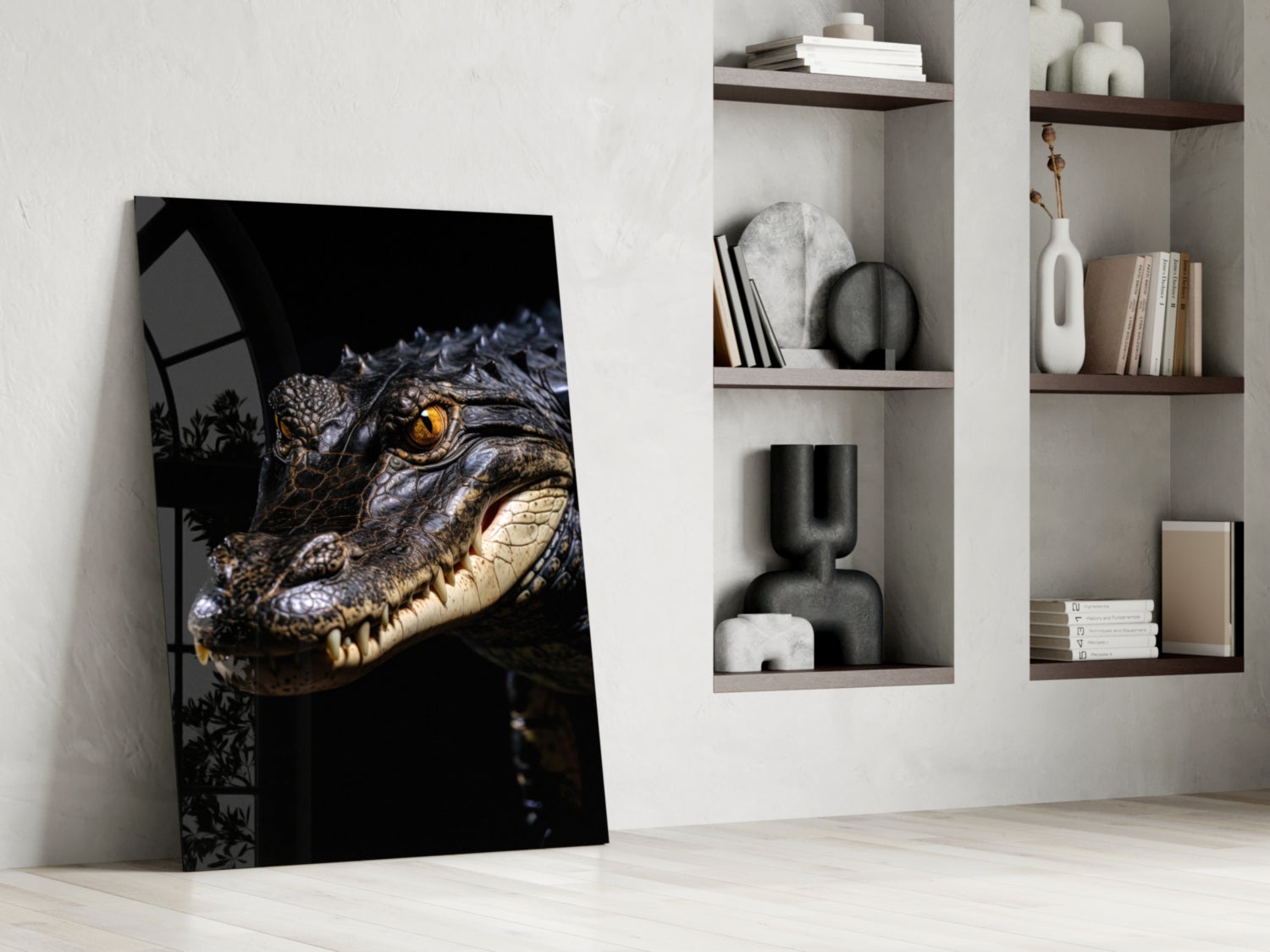 Glass art print leaning against white wall displaying crocodile's head with golden eye against black background, styled with shelving unit.