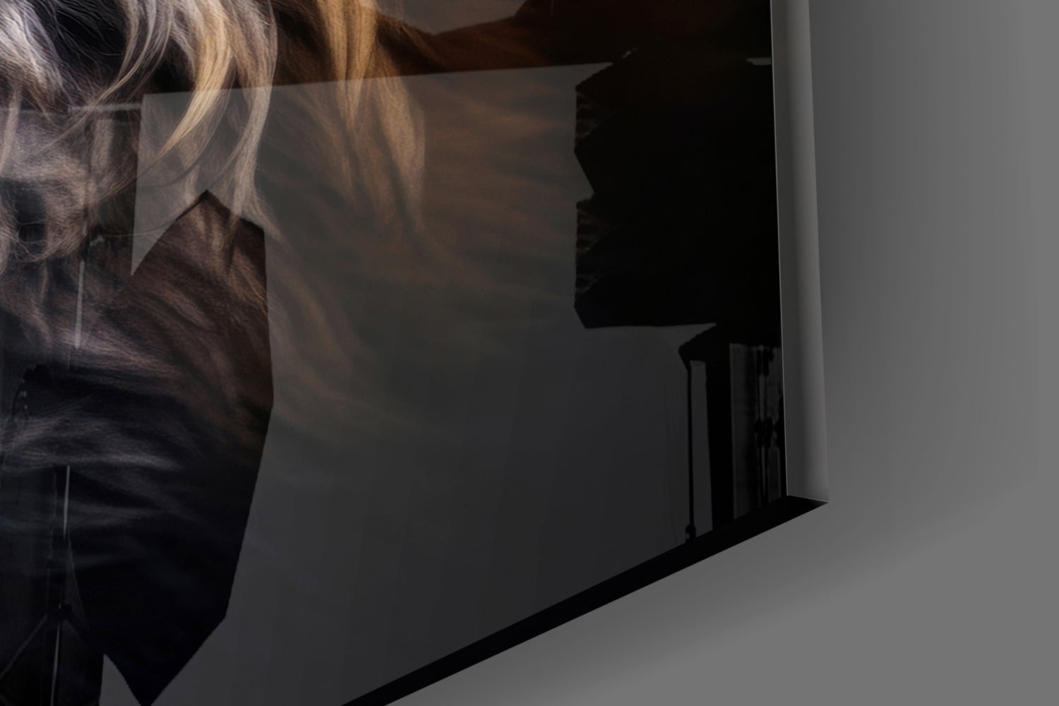 Close-up side view of glass wall art showing a fox's profile with golden and dark tones against a white wall.