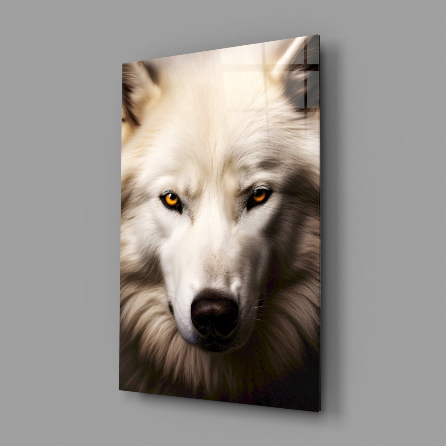 Close-up portrait of a white wolf with golden eyes and dark nose on glass wall art, mounted on gray wall.