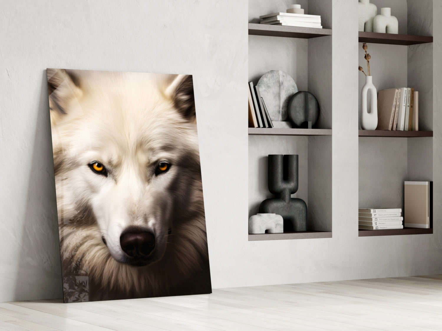Glass wall art leaning against white wall showing close-up white wolf with amber eyes and dark nose.