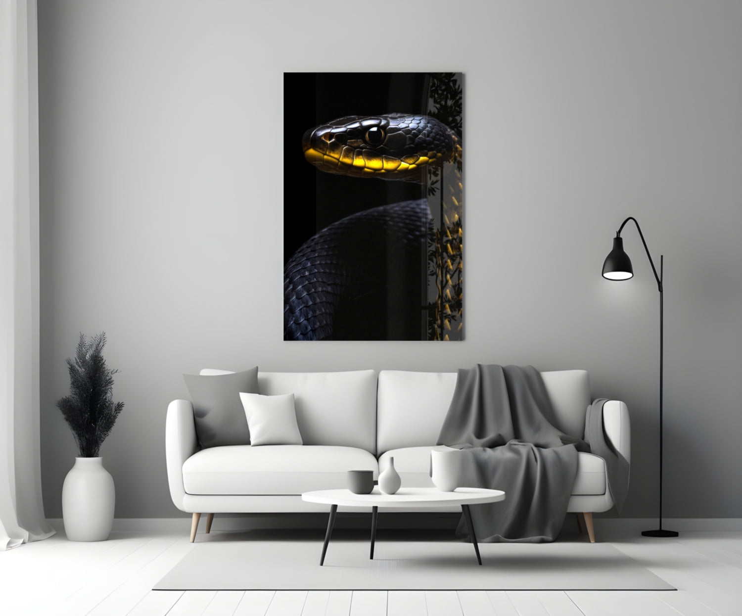 Black and yellow viper glass wall art mounted above white sofa in minimalist living room setting.