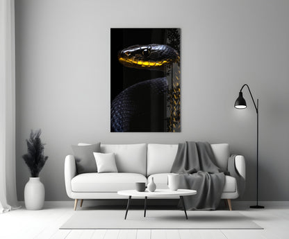 Black and yellow viper glass wall art mounted above white sofa in minimalist living room setting.