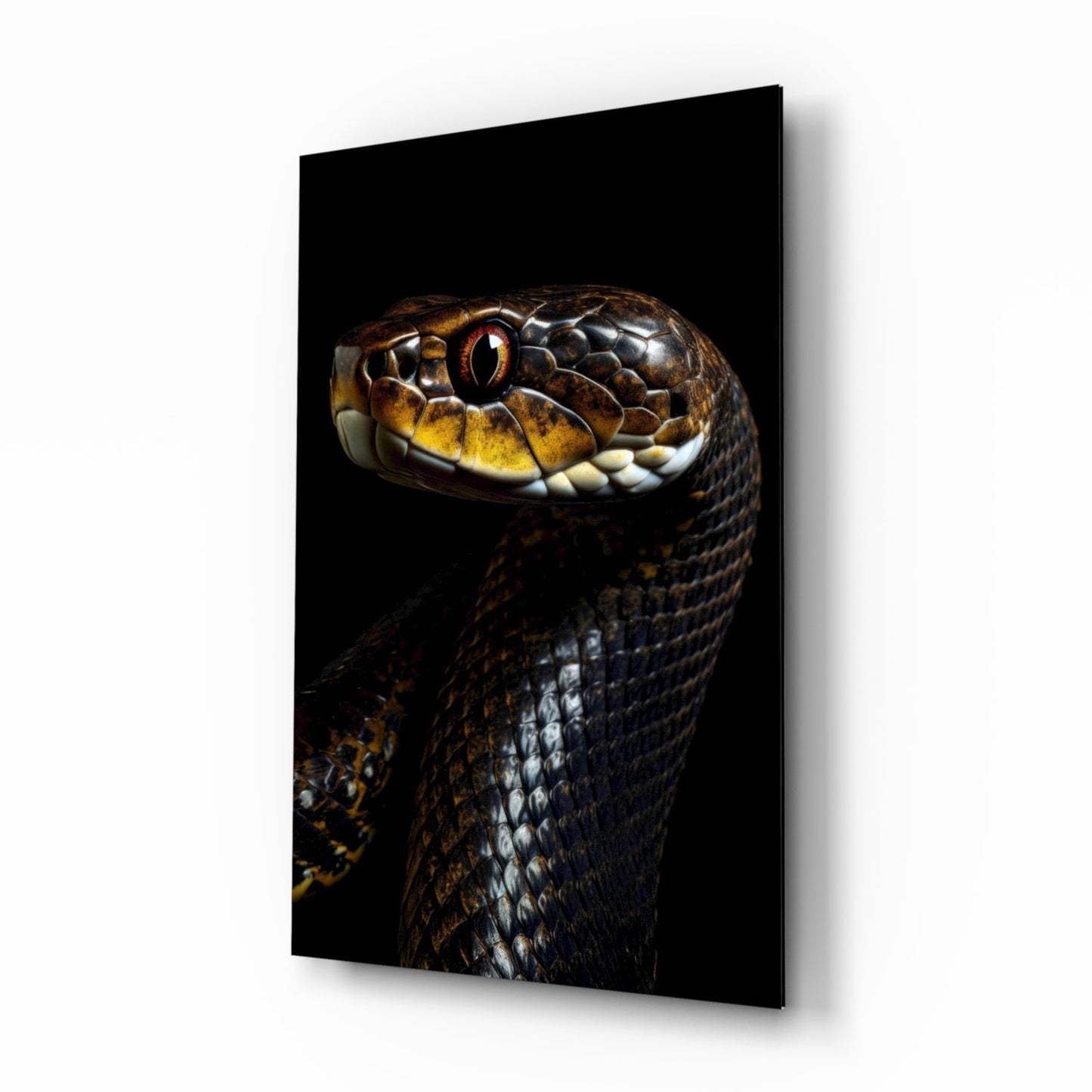 Close-up of a snake's head with golden eye and brown-patterned scales on black glass wall art, angled three-quarter view.