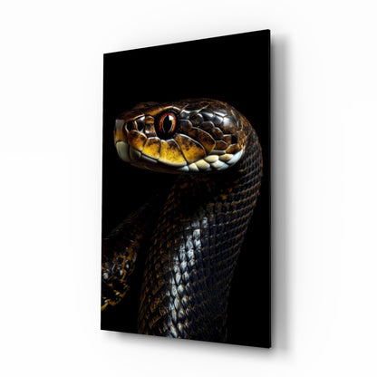 Close-up of a snake's head with golden eye and brown-patterned scales on black glass wall art, angled three-quarter view.