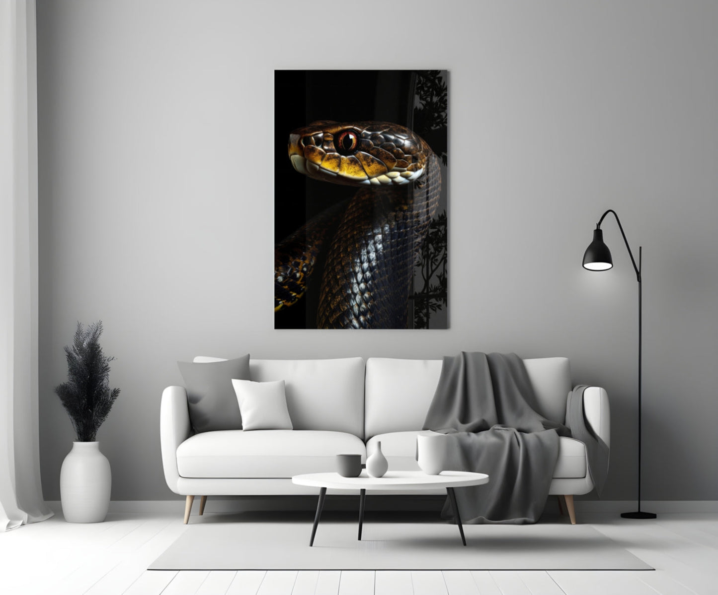 Golden-eyed black snake glass wall art displayed above white sofa in modern living room setting.